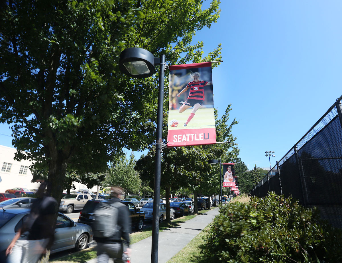 Street banners along Cherry Street showcasing SU Athletics
